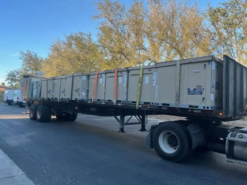 Transport trailer carrying moving containers at the company facility