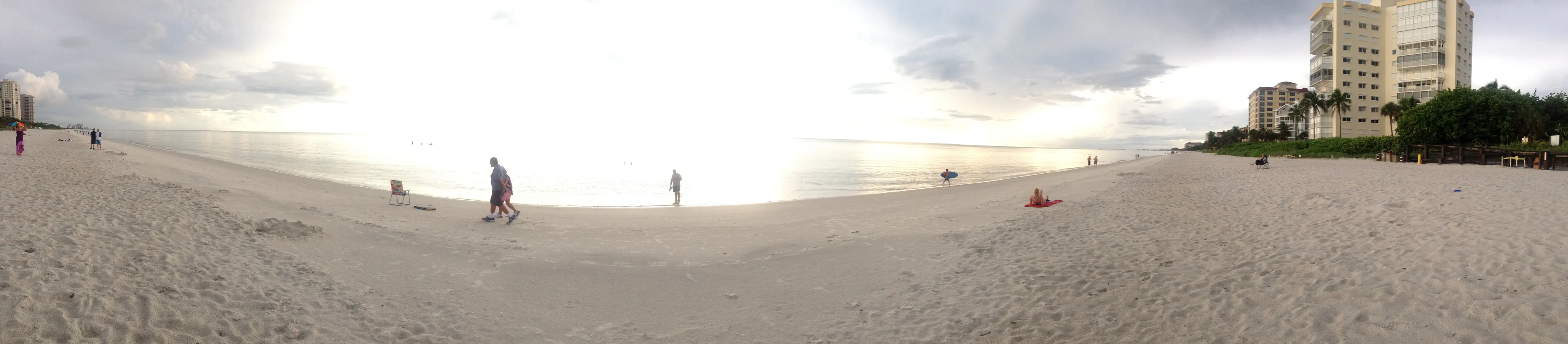 A panoramic view along Vanderbilt Beach and nearby beachfront buildings